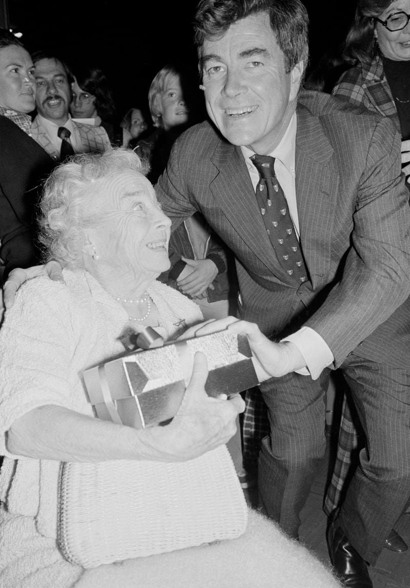 FILE - Representative Paul "Pete" McCloskey, of the 12 Congressional district, presents his mother, Vera, 84, with a corsage at a victory celebration in his honor after he defeated David Harris, a Democrat, Nov. 3, 1976, in Palo Alto, Calif. Former Congressman McCloskey, who ran as a Republican challenging President Richard Nixon in 1972, has died at age 96. (AP Photo/John Storey, File)