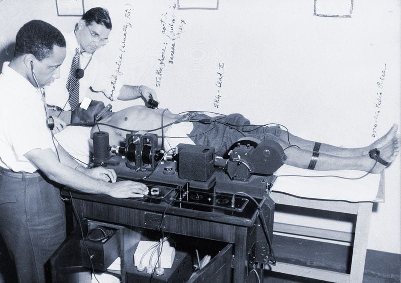 Researchers for the U.S. Public Health Service use an electrocardiogram to check the heart of a participant in the Tuskegee Syphilis Study — most likely in 1932. (National Archives)