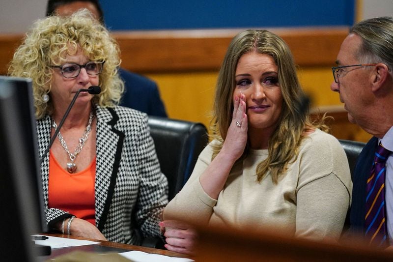 Jenna Ellis reacts after reading a statement pleading guilty to one felony count of aiding and abetting false statements and writings inside Fulton Superior Court Judge Scott McAfee's Fulton County Courtroom in Atlanta, on Oct. 24, 2023.  (John Bazemore/Pool/AFP/Getty Images/TNS)