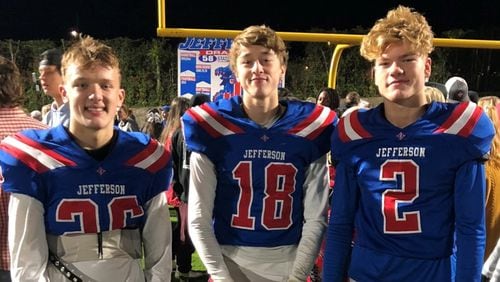 Bowman Horn (left), Max Aldridge (center) and Elijah DeWitt (right) pose for a photo after a Jefferson High School football game during their freshman year. (Photo courtesy of Bowman Horn)