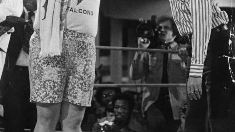 Atlanta Mayor Maynard Jackson "knocked out" Muhammad Ali in 1975, with then Georgia state Sen. Julian Bond officiating. AJC archives photo/Billy Downs