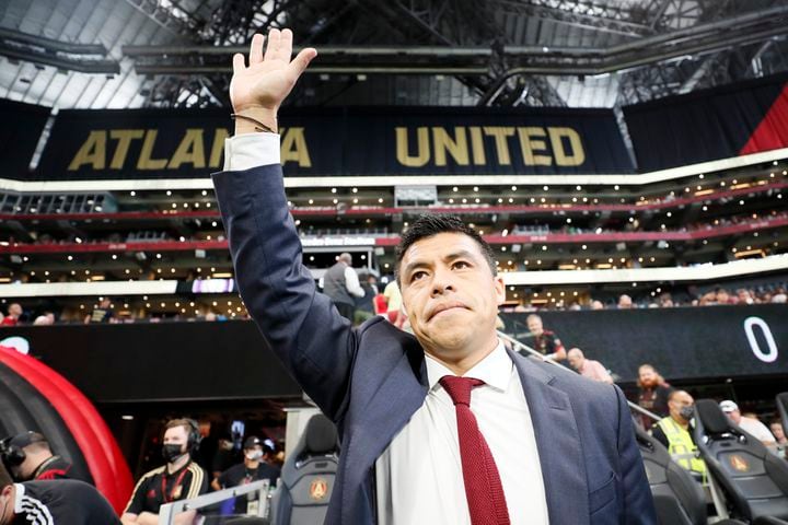 Atlanta United manager Gonzalo Pineda waves to the fans after being introduced before the game against Orlando on Sunday at Mercedes-Benz Stadium. (Miguel Martinez /Miguel.martinezjimenez@ajc.com)