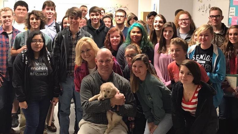 Students at Clements High School surprised their teacher Troy Rogers with a puppy after his dog had run away.