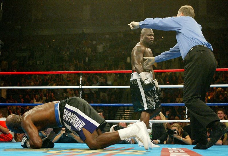 Evander Holyfield is knocked down by James Toney while referee Jay Nady sends Toney to a neutral corner during the ninth round of their 12-round heavyweight bout Saturday Oct. 4, 2003, at The Mandalay Bay Resort & Casino in Las Vegas.