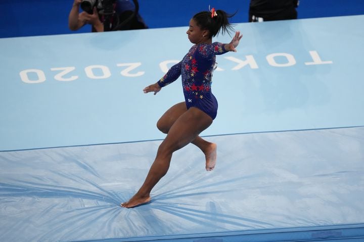Simone Biles, of the United States, performs on the balance beam during women's qualification for the Artistic Gymnastics final at Ariake Gymnastics Center in Tokyo on Sunday, July 25, 2021. (Doug Mills/The New York Times)