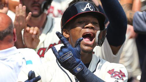 Braves Ronald Acuna Jr. reacts in the dugout after hitting a two-run homer to take a 4-2 lead over the Milwaukee Brewers during the second inning in a MLB baseball game on Sunday, August 12, 2018, in Atlanta.  Curtis Compton/ccompton@ajc.com