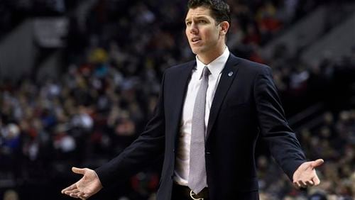 FILE - In this Jan. 8, 2016, file photo, Golden State Warriors assistant coach Luke Walton gestures during the first half of the team's NBA basketball game against the Portland Trail Blazers in Portland, Ore. The Los Angeles Lakers have reached an agreement with Walton to become their head coach. The Lakers made the announcement Friday night, April 29, 2016, five days after firing Byron Scott. (AP Photo/Steve Dykes, File)