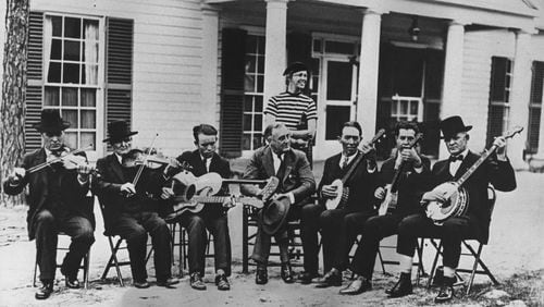 Franklin Delano Roosevelt sits with a group of musicians in the front yard of his retreat home, the Little White House, in Warm Springs, Ga. Jim Frazer/Atlanta Journal-Constitution