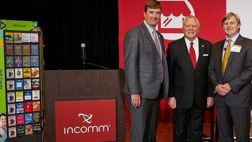 From left: Bert Brantley, chief operating officer at the state Department of Economic Development, Gov. Nathan Deal and Scott Meyerhoff, COO and chief financial officer of InComm.