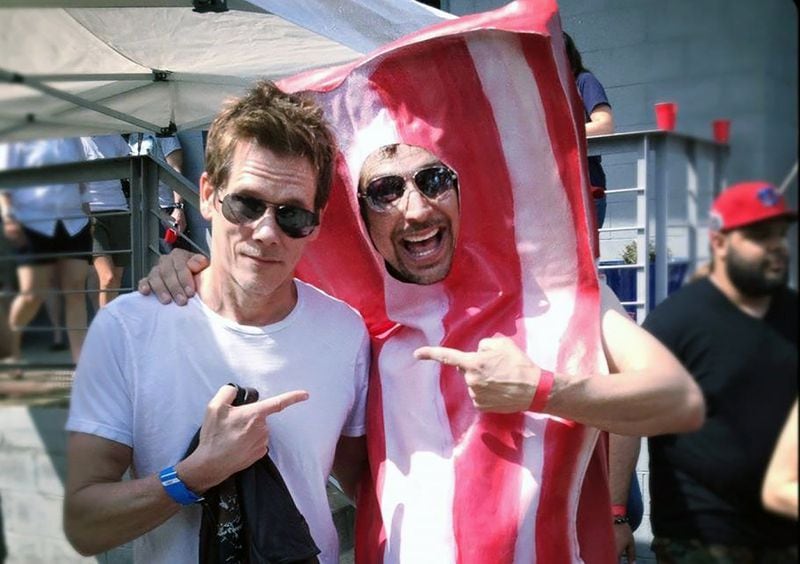 Kevin Bacon makes an appearance at Dad's Garage's BaconFest in 2012. He's with Lucky Yates, one of the organization's long-running performers. Contributed. 