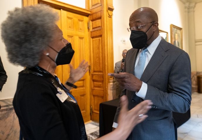 220307-Atlanta-U.S. Sen. Raphael Warnock is greeted by State Sen. Valencia Seay (D-Riverdale) as he arrives to qualify Monday, Mar. 7, 2022 at the Georgia State Capitol. Ben Gray for the Atlanta Journal-Constitution