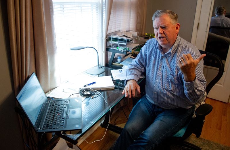 Randy Michael talks about his parent college student loan debt in his Alpharetta home office on Oct. 29, 2021. (Steve Schaefer for The Atlanta Journal-Constitution) 