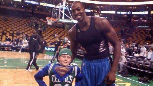Dwight Howard poses with eight-year-old Connor Spencer in Bostons in 2008 when the center was a member of the Magic. Photo provided by The Bador Family