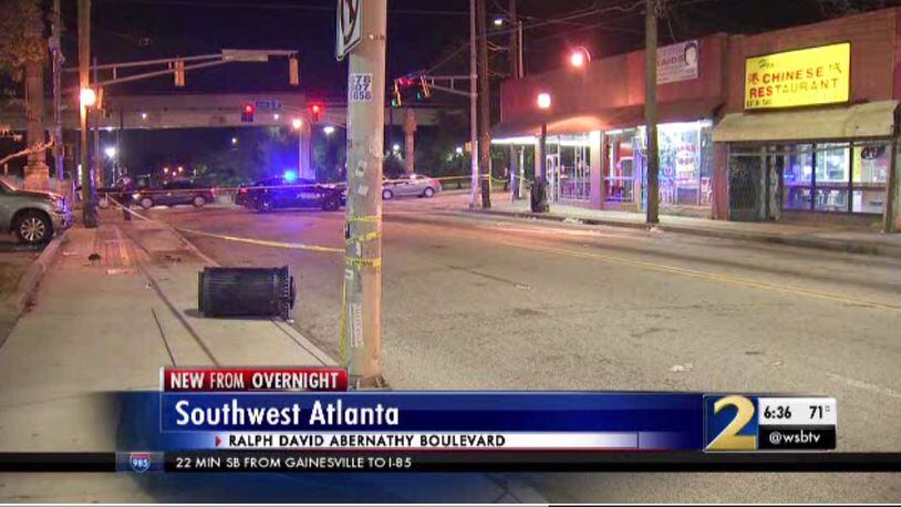 Police investigate a crash at the intersection of Ralph David Abernathy Boulevard and Lee Street in southwest Atlanta Sunday night.