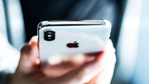 Government agencies and consumer advocates in the radio industry are continuing to apply pressure on Apple to activate the FM chip in its iPhones. (Dreamstime/TNS)