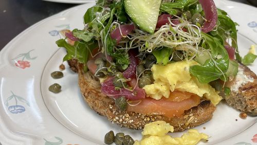 The smoked salmon tartine at Douceur de France includes rye bread, cream cheese, fluffy scrambled eggs and colorful salad. Courtesy of Douceur de France