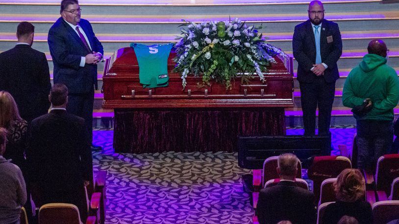 The coffin of Roswell High School football player Robbie Roper is moved into the church before the start of his funeral service at the First Baptist Church of Woodstock on Tuesday, Dec. 28, 2021.   STEVE SCHAEFER FOR THE ATLANTA JOURNAL-CONSTITUTION