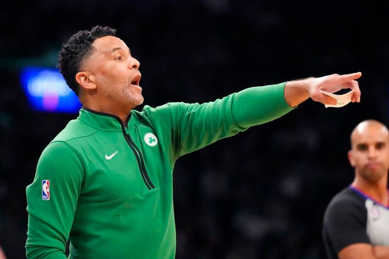 Boston Celtics assistant coach Damon Stoudamire, filling in for interim head coach Joe Mazzulla, calls to his players during the first half of an NBA basketball game against the LA Clippers, Thursday, Dec. 29, 2022, in Boston. (AP Photo/Charles Krupa)