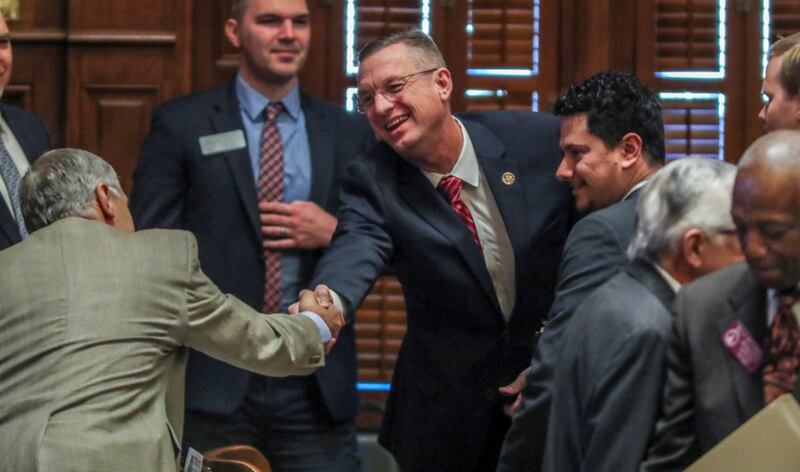 January 28, 2020 Atlanta: U.S. Rep. Doug Collins (center) shakes hands with members of the House before he addressed the Georgia House on Tuesday, Jan. 28, 2020 as its Chaplin of the day. This coming just hours after news broke that Collins is preparing to challenge U.S. Sen. Kelly Loeffler, and avoided any mention of seeking a higher office. In his sermon and closing prayer, Collins honored Rep. Jay Powell, the House Rules Committee chairman who died in November and who Collins described as a mentor. Speaker David Ralston signaled his support of the soon-to-be senate candidate, stopping short of an explicit endorsement. Collins and Ralston have a strong relationship dating back to their time as state house colleagues; Collins voted for Ralstonâ€™s speakership while deployed in Iraq. â€œHe is my friend. He has stood by me when few would,â€ Ralston said.â€And I donâ€™t forget things like that.â€ JOHN SPINK/JSPINK@AJC.COM