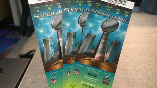 Real tickets have a number of security measures, including raised surfaces, holograms and other elements. No matter how real the fake ones look, they won't get you into the game, officials warn. Photo: Jennifer Brett
