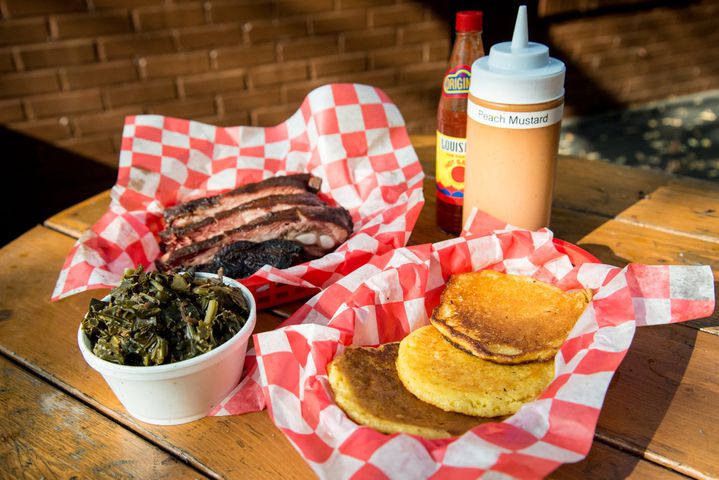 Ribs with hoe cakes and collard greens at B’s Cracklin’ Barbecue in Riverside. CONTRIBUTED BY MIA YAKEL