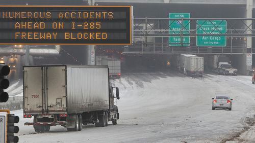 Metro area highways and roads were coated with snow and ice this month, leading to students missing multiple days of school. Photo: John Spink