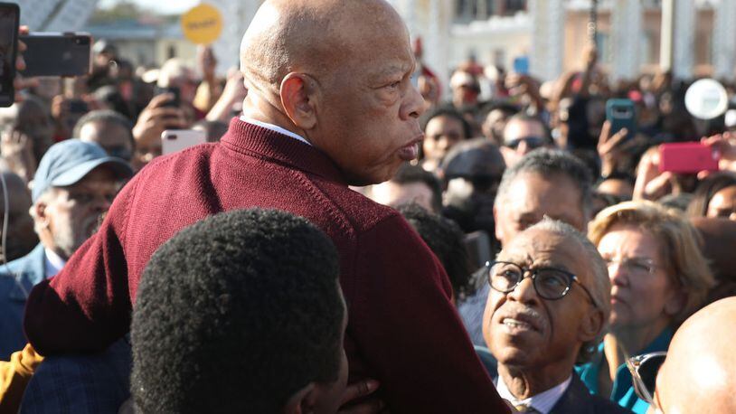 SELMA, ALABAMA - MARCH 01:  Rep. John Lewis (D-GA) is held aloft by Rev. Al Sharpton and others as he speaks to the crowd at the Edmund Pettus Bridge crossing reenactment marking the 55th anniversary of Selma's Bloody Sunday on March 1, 2020 in Selma, Alabama. Mr. Lewis marched for civil rights across the bridge 55 years ago. Some of the 2020 Democratic presidential candidates attended the Selma bridge crossing jubilee ahead of Super Tuesday. (Photo by Joe Raedle/Getty Images)