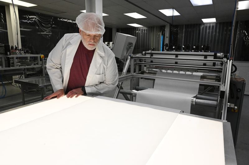 Patrick Burton supervises a sheet production line at ThermoPore Materials Corporation, a plastics manufacturer in Newnan. ThermoPore received government approval to make a new type of N95 that utilizes a different filtration material. (Hyosub Shin / Hyosub.Shin@ajc.com)