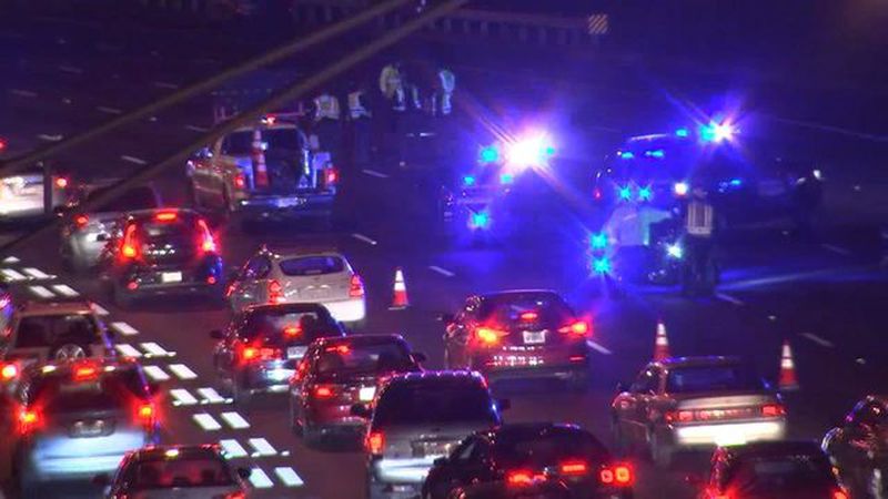 All southbound lanes were blocked Tuesday night after a woman was hit by three cars on the Downtown Connector. (Credit: Channel 2 Action News)