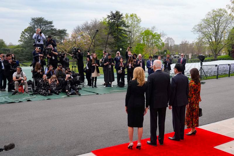 From l-r., first lady Jull Biden, President Joe Biden, Japanese Prime Minister Fumio Kishida and his wife Yuko Kishida pose for a group photo upon their arrival at the White House, Tuesday, April 9, 2024, in Washington. (AP Photo/Alex Brandon)