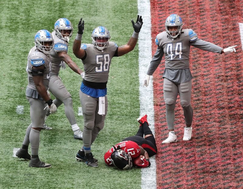 Detroit Lions linebacker Jamie Collins signals touchdown as Falcons running back Todd Gurley attempted to stop short of the goal line to expend more time on the clock in the fourth quarter Sunday, Oct. 25, 2020, at Mercedes-Benz Stadium in Atlanta. Gurley's touchdown gave Atlanta a 20-16 lead and the Falcons added the 2-point conversion to extend the lead to 22-16 with a minute left in the game. The Lions scored as time expired to win 23-22. (Curtis Compton / Curtis.Compton@ajc.com)