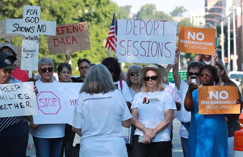 August 9, 2018, Macon: Several dozen protesters gather across the street from the United Sates Attorney's Office for the Middle District of Georgia during a visit by Attorney General Jeff Sessions on Thursday, August 9, 2018, in Macon.  Curtis Compton/ccompton@ajc.com
