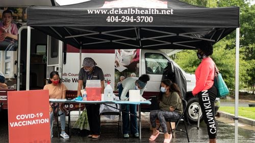 210719-Decatur-People get Covid-19 vaccinations at a DeKalb County Board of Health mobile clinic at Decatur High School on Monday afternoon, July 19, 2021. Ben Gray for the Atlanta Journal-Constitution