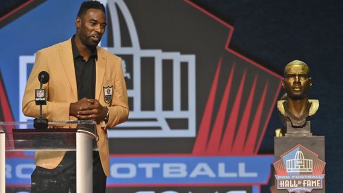 Calvin Johnson, a member of the Pro Football Hall of Fame Class of 2021, speaks during the induction ceremony at the Pro Football Hall of Fame, Sunday, Aug. 8, 2021, in Canton, Ohio. (David Richard/AP)