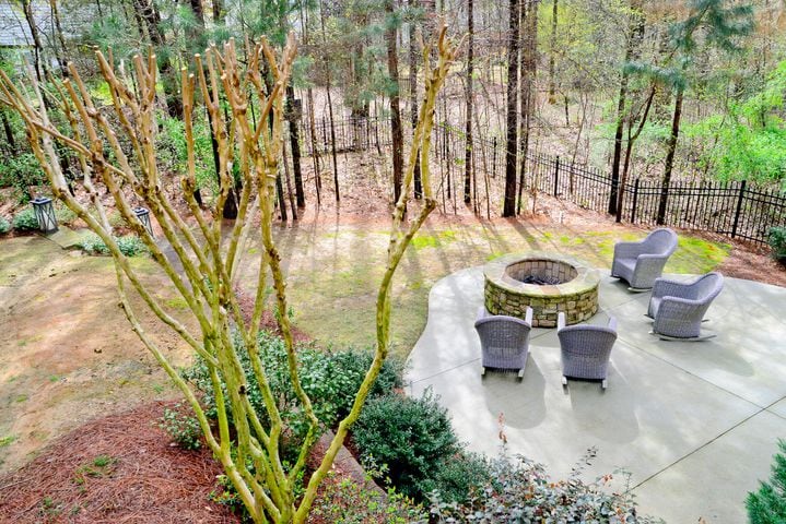 Patio with custom fire pit for entertaining in Alpharetta