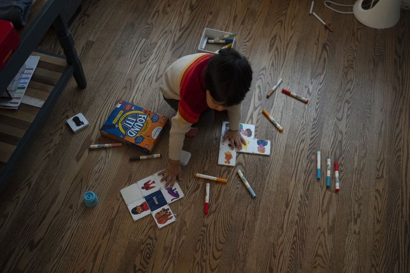 Ethan Quinn, 4, plays in the living room of his home before going to his daycare center in Concord, Calif., Wednesday, Nov. 1, 2023. (AP Photo/Jae C. Hong)