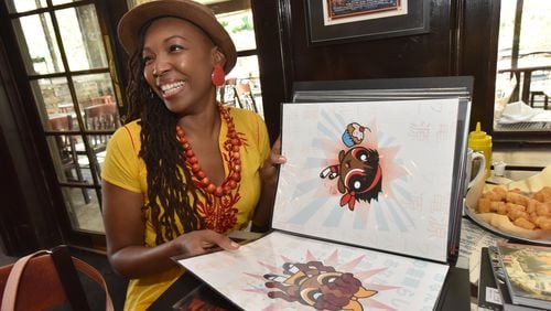 Comic book artist Afua Richardson, the illustrator on John Lewis’ new graphic novel “Run,” shows off her puckish version of the Power Puff Girls. (She turns the superheroes into girls of color and calls them Cocoa Puff Girls.) HYOSUB SHIN / HSHIN@AJC.COM