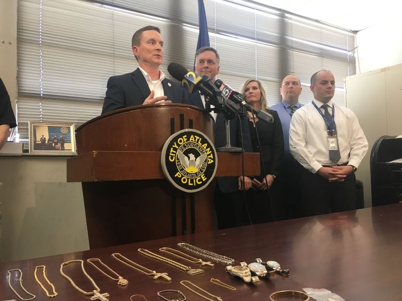 Stuart VanHoozer, deputy chief of the Cobb County Police Department, speaks at a news conference announcing the arrests of five suspects in connection with a February home invasion and jewelry store burglary.