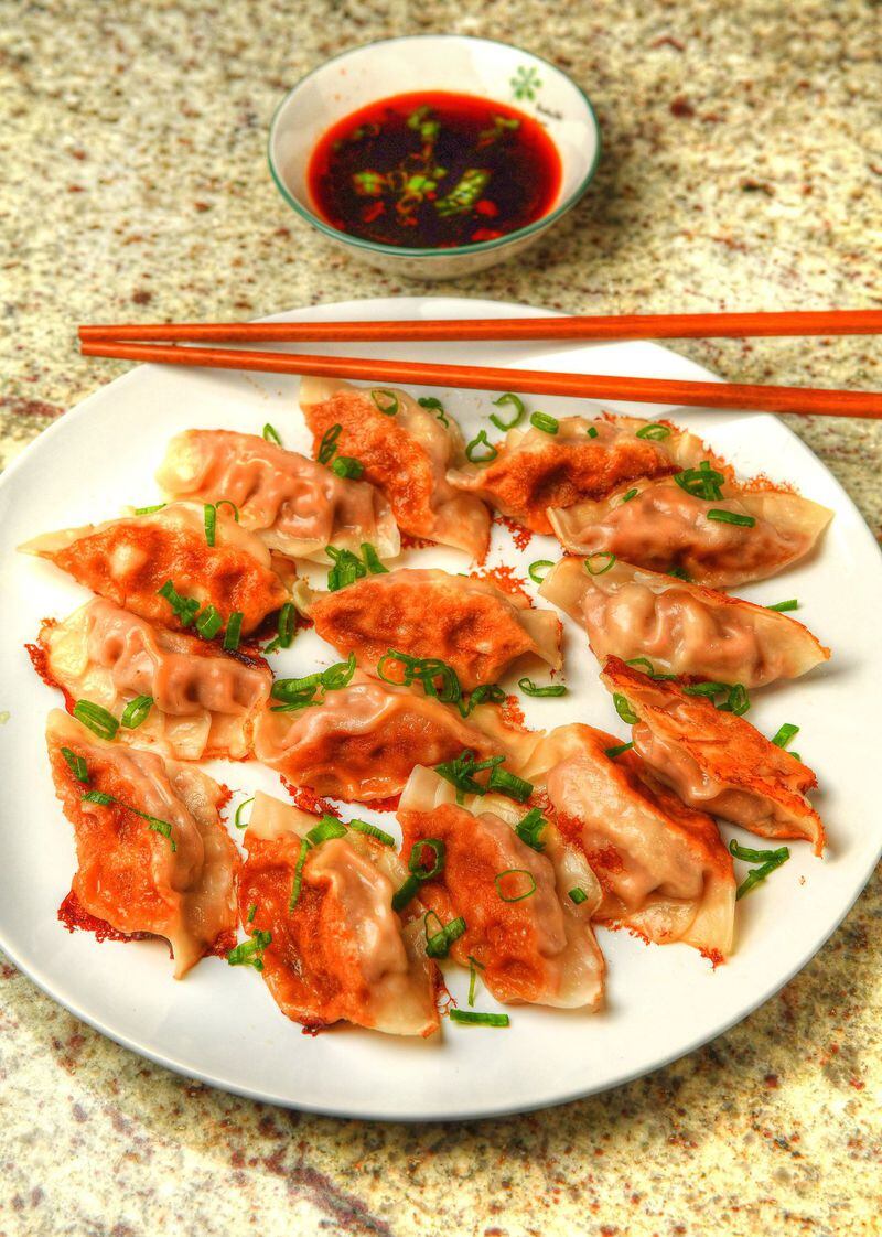 Pork and Cabbage Dumplings (Jiaozi), made from a family recipe from Jennifer McCormick, probably won’t last long at your Lunar New Year’s gathering, but if you fear you’re making too many, you can freeze some of the uncooked ones for later. STYLING BY JENNIFER MCCORMICK / CONTRIBUTED BY CHRIS HUNT PHOTOGRAPHY