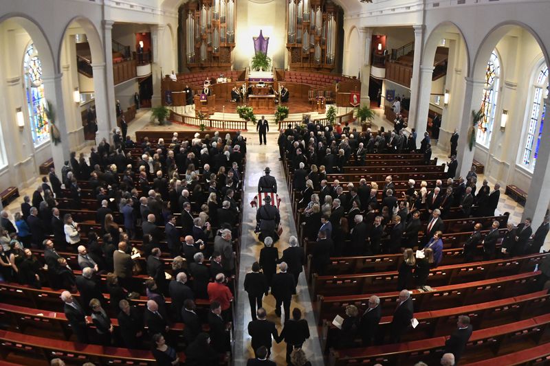 The casket is brought in during the funeral for former Governor and U.S. Senator Zell Miller held at Peachtree Road United Methodist Church, Tuesday March 27, 2018, in Atlanta. Miller, a conservative democrat, died at 86 from complications from Parkinson's disease four days ago on March 23 at his home in Young Harris, Ga. (John Amis)
