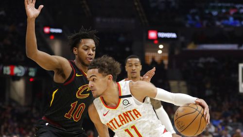 Atlanta Hawks' Trae Young (11) drives past Cleveland Cavaliers' Darius Garland (10) in the second half of an NBA basketball game, Wednesday, Feb. 12, 2020, in Cleveland. The Cavaliers won 127-105. (AP Photo/Tony Dejak)