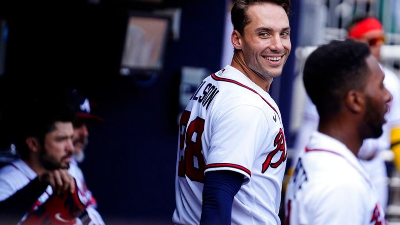 Atlanta Braves' Matt Olson (28) celebrates in the dugout after a home run in the first inning of a baseball game against the San Diego Padres, Saturday, May 14, 2022, in Atlanta. (AP Photo/Brynn Anderson)