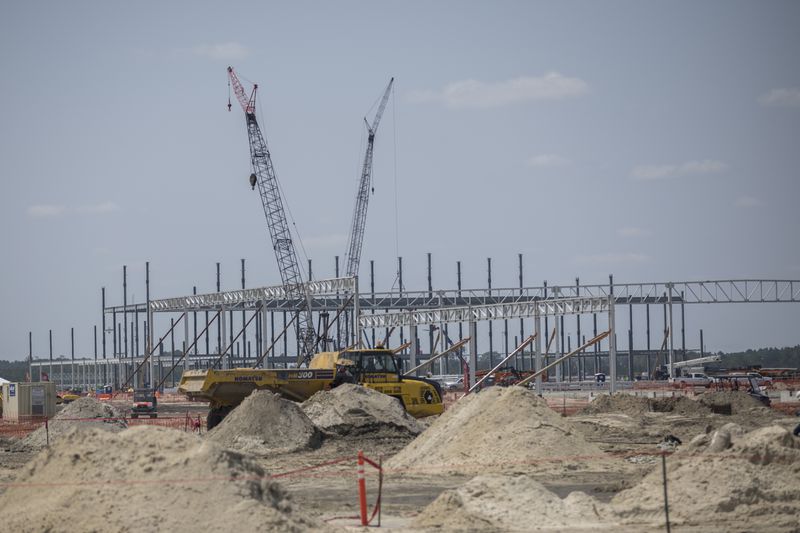 ELLABELL, GA. - JUNE 5, 2023: Large cranes and heavy earth-moving equipment work a construction site at the Hyundai Metaplant site, Monday, July 5, 2023, in Ellabell, Ga. (AJC Photo/Stephen B. Morton)