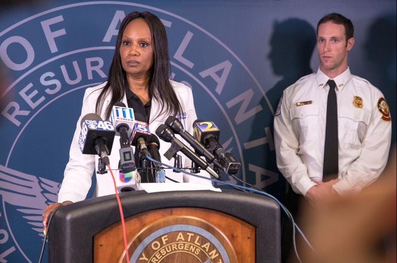 04/05/2018 -- Atlanta, GA - Fulton County Chief Medical Examiner Jan Gorniak, center, answers questions during a press conference at the Atlanta Police Department headquarters, Thursday, April 5, 2018.  The Fulton County Medical Examiner's office says that Cunningham likely drowned while on a run. His body was found surrounded by mud in the river. ALYSSA POINTER/ALYSSA.POINTER@AJC.COM