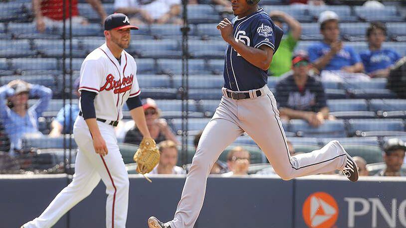 Padres Melvin Upton Jr. scores on a 2 RBI single by Yangervis Solarte to beat the Braves 6-4 in 11th inning Thursday, June 11, 2015, at Turner Field in Atlanta.