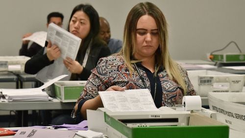 Gwinnett County election workers count provisional ballots one week after Election Day. HYOSUB SHIN / HSHIN@AJC.COM