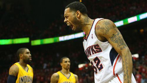 050114 ATLANTA: Hawks Mike Scott reacts after slamming for two points against the Pacers during the second half of their First Round Game 6 contest on Thursday, May 1, 2014, in Atlanta. CURTIS COMPTON / CCOMPTON@AJC.COM