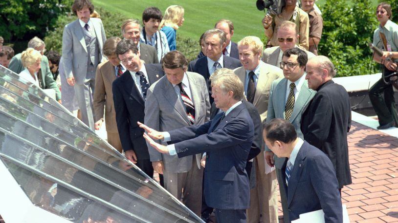 President Jimmy Carter shows off the "solar system" that was installed on the roof of the White House during his administration. Dedicated on June 20, 1979, the 32 thermal collectors were visible from Pennsylvania Avenue and supplied solar heated water that was primarly used in the White House mess kitchen. The solar panels were removed from the roof during President Ronald Reagan's administration in 1986. (Jimmy Carter Library)