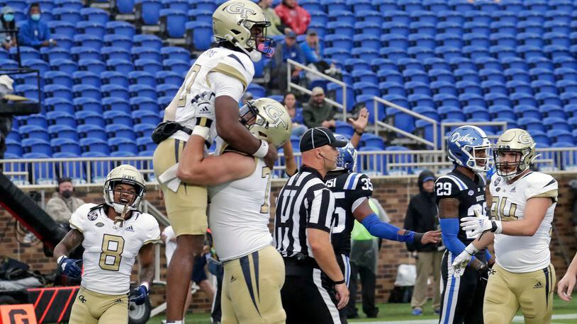 Georgia Tech quarterback Jeff Sims (10) celebrates his touchdown with teammates after he scored against Duke during the first half of an NCAA college football game in Durham, N.C., Saturday, Oct. 9, 2021. (AP Photo/Chris Seward)