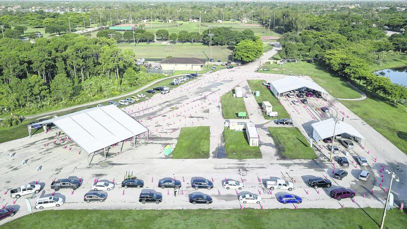 An aerial view shows cars lining up at Tropical Park's COVID-19 testing site in Miami. The new variant mu is believed to be even more transmissible than the delta variant and has the potential to resist vaccines, officials say. (Matias J. Ocner/Miami Herald/TNS)